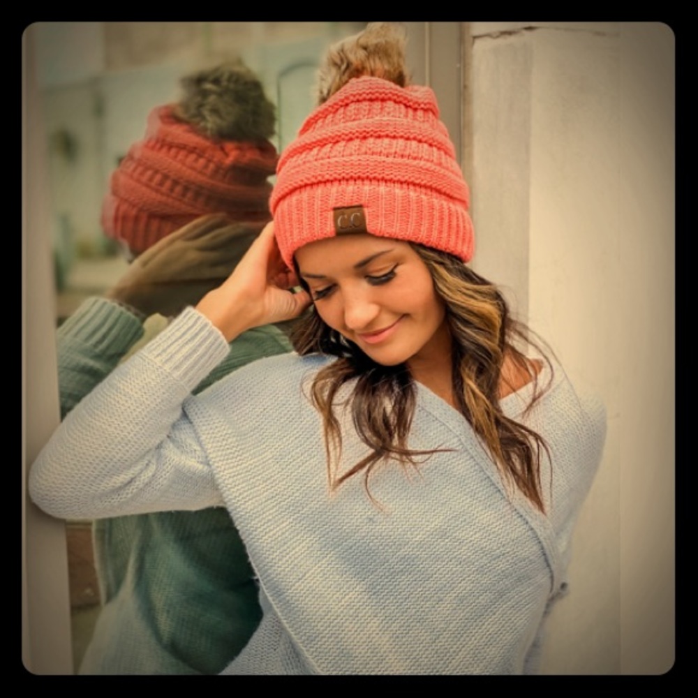 Soft coral C.C beanie with fur pom. Good as new!